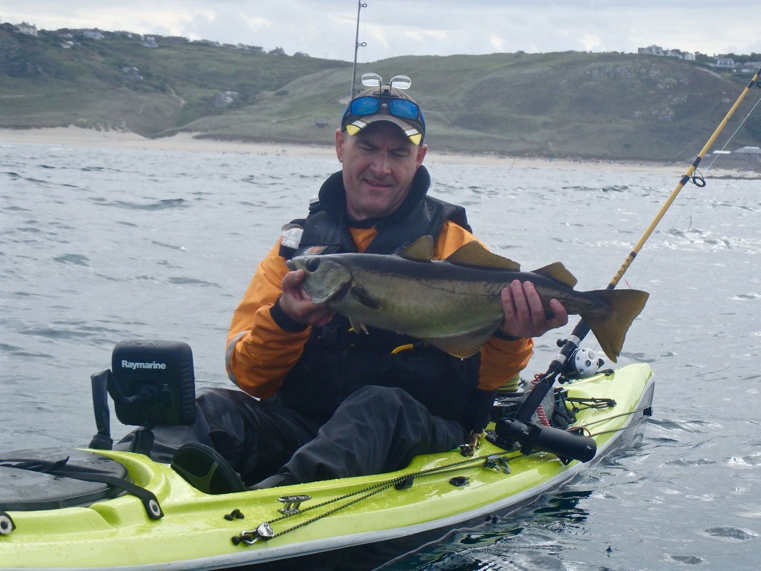 Kevin with a Pollack on his Jensen at the Penzance Kayak Fishing Meet 2015