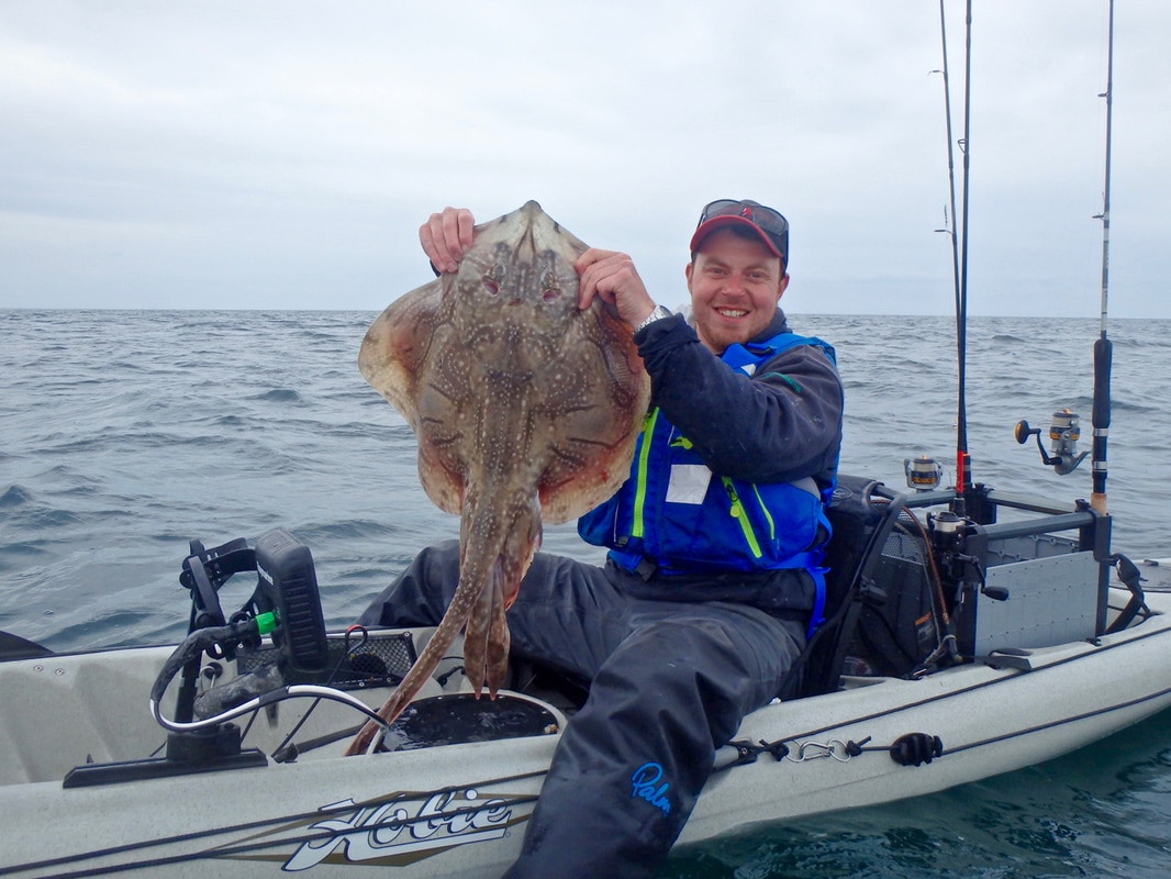 Ben with a 12lb Undulate Ray caught on his Revo 16 
