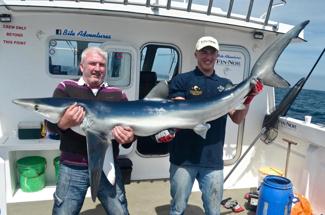 Bob Pollard with a 97lb Blue Shark on Bite Adventures