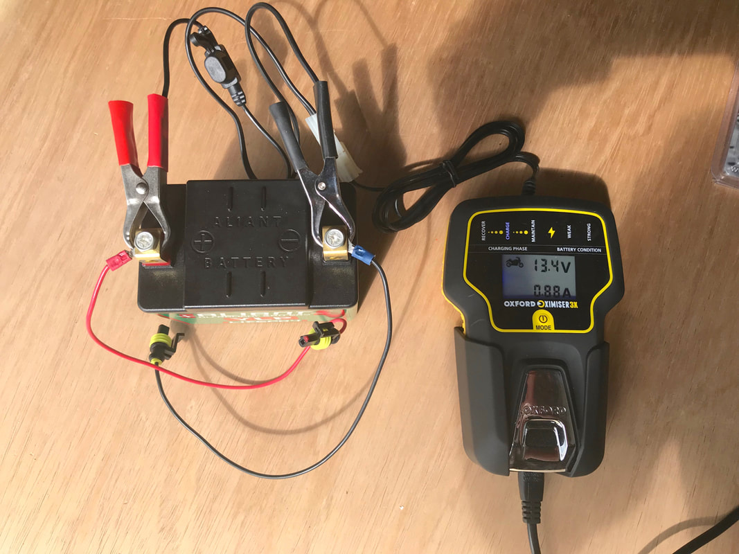 Oxford Oximiser 3X Advanced Battery Management Charger charging a Lithium Motorcycle Battery