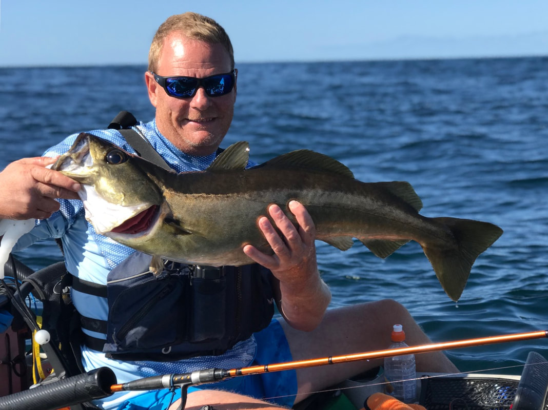 Craig with a 10lb pollock caught at the Penzance Kayak Fishing Meet