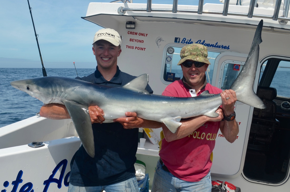 Kieren with a Blue Shark of 50lb on Bite Adventures Fishing Trips