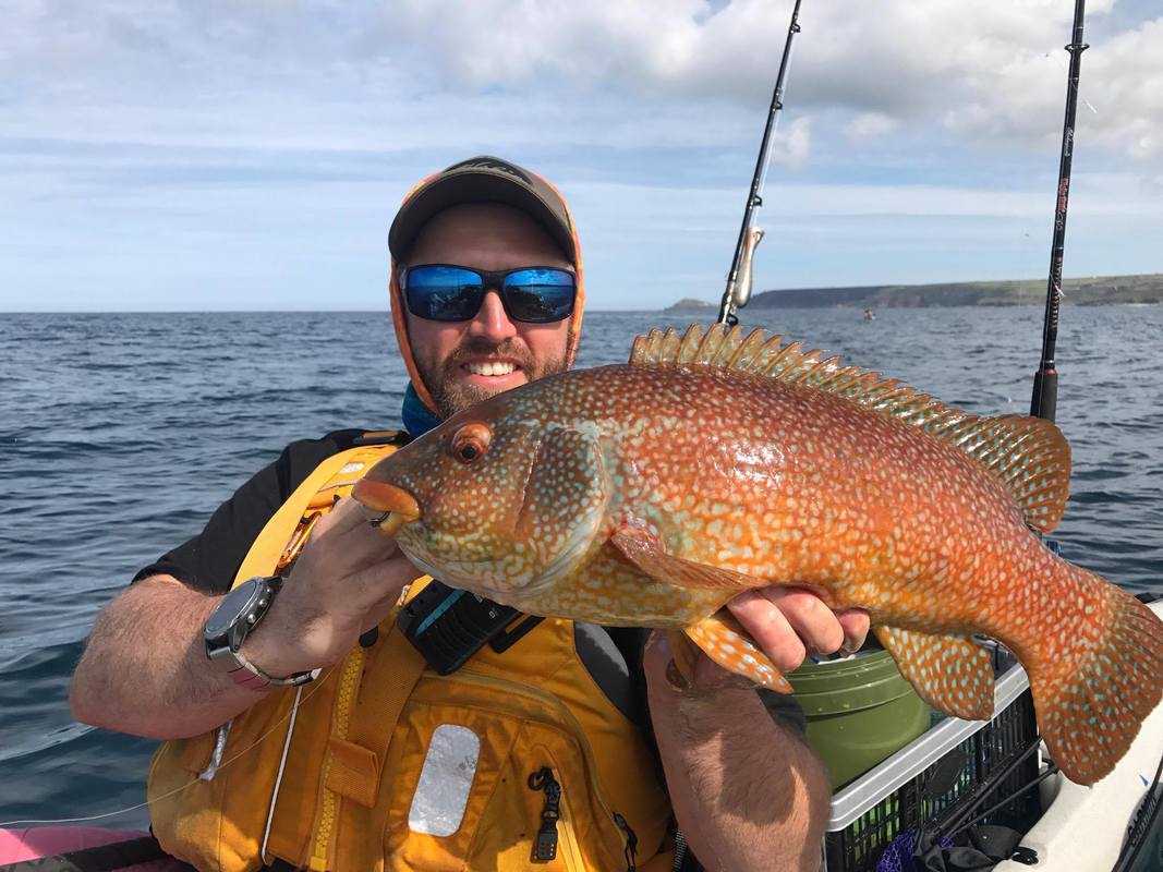 Kyle with a 5lb Ballan Wrasse on his Hobie Revolution 16