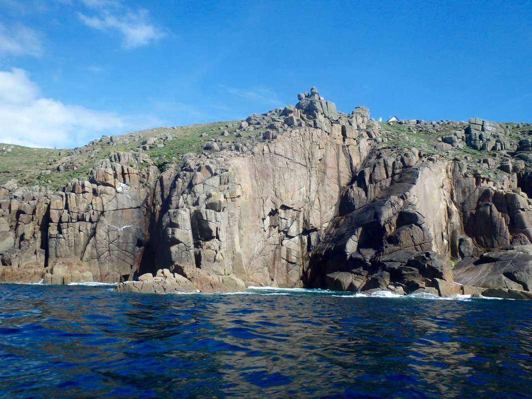Kayaking beneath the cliffs at Lands End