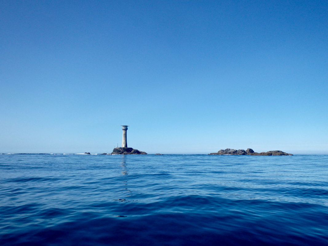 Longships Lighthouse in calm seas