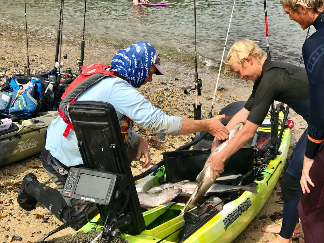 Mark Radcliffe displaying his catch at the Penzance Kayak Fishing Meet 2019