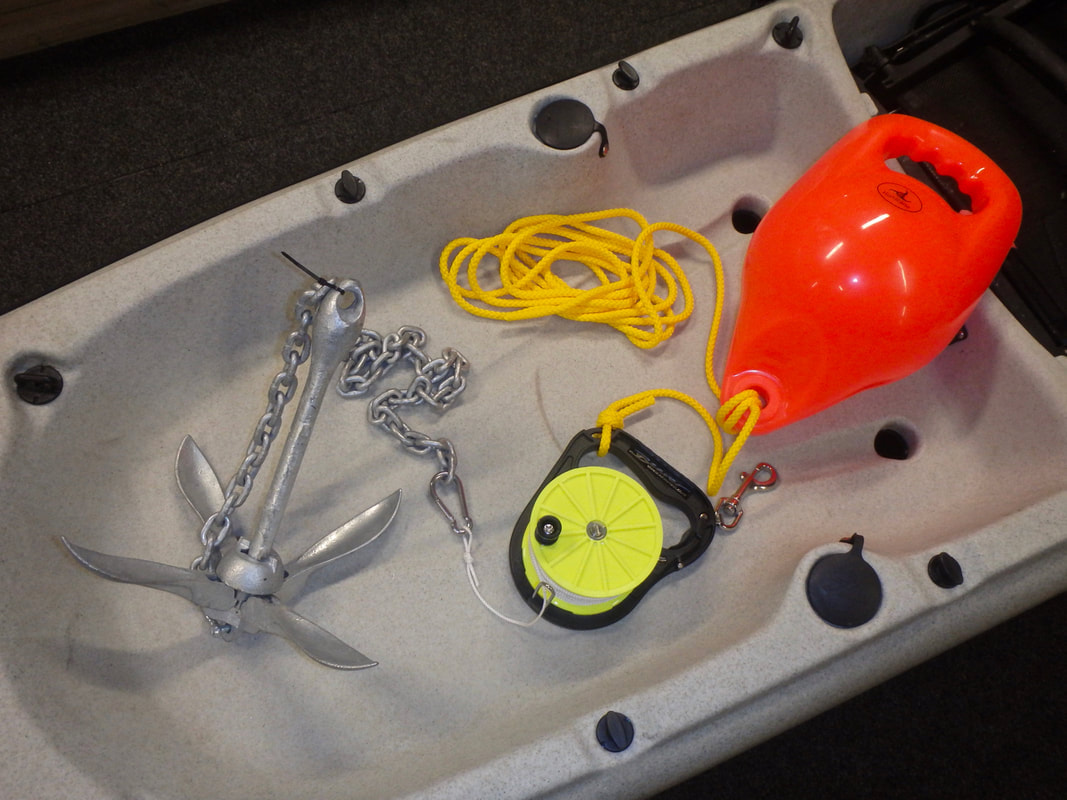 A quick release anchoring kit set up on a kayak
