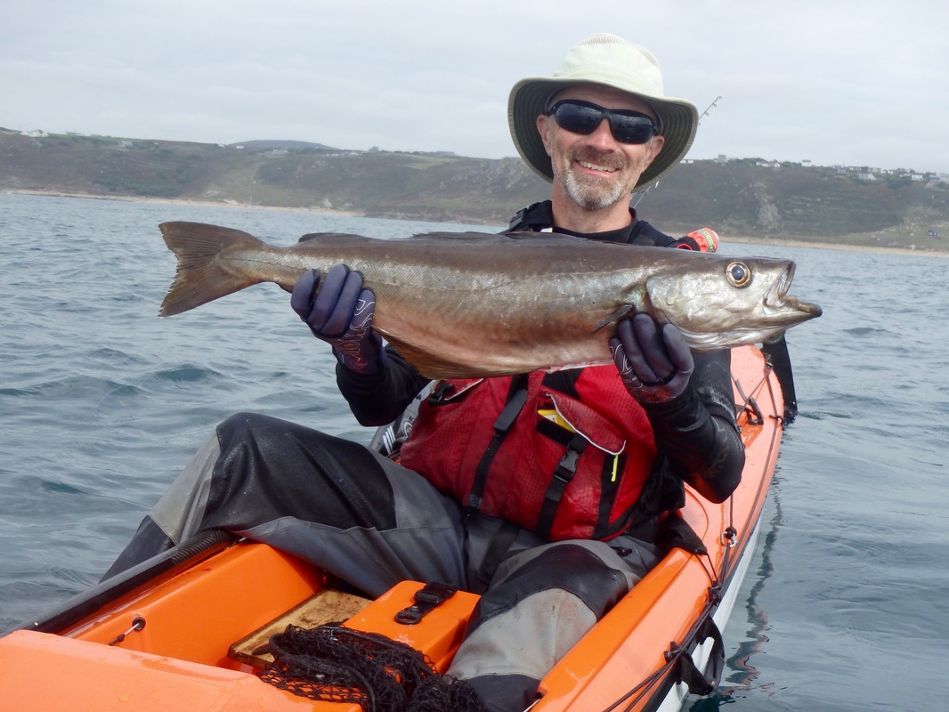 Richard with a 10lb Pollack caught at caught at the Penzance Kayak Fishing Meet