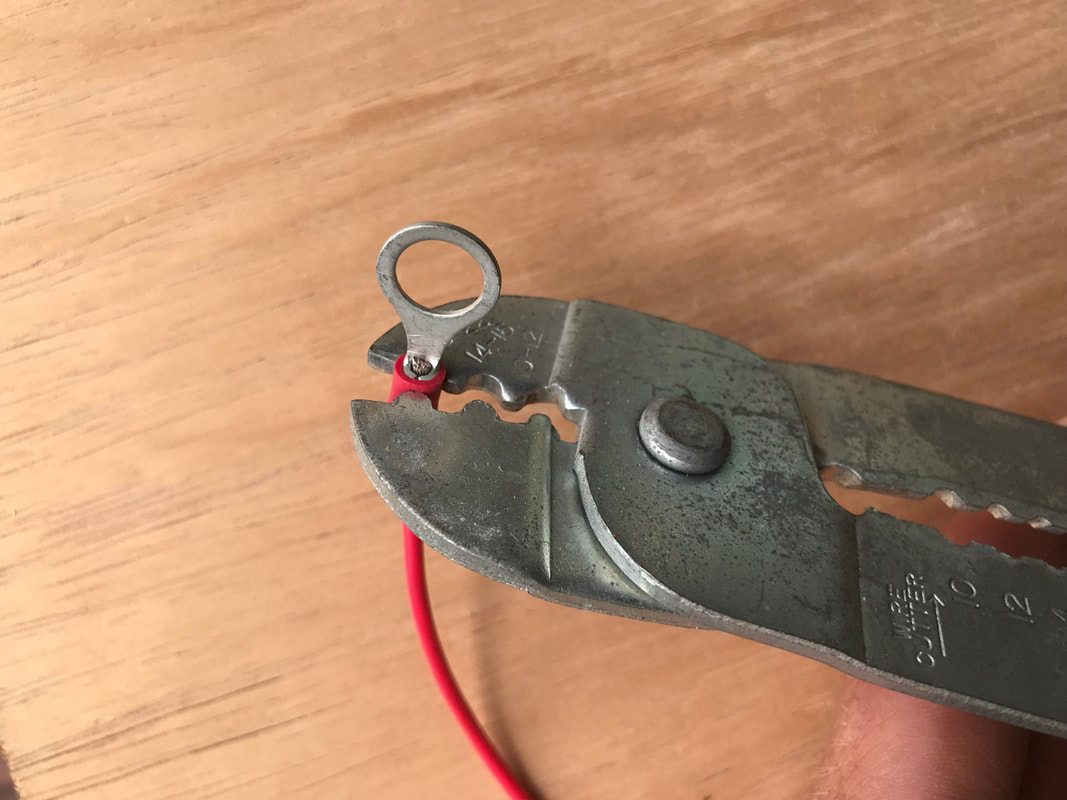 Crimping on ring terminal ends to a wire