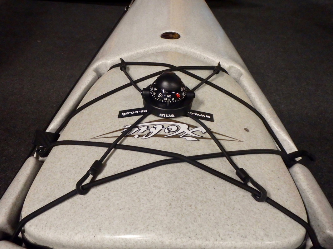 A Silva Kayak Compass installed on the bow of a fishing kayak